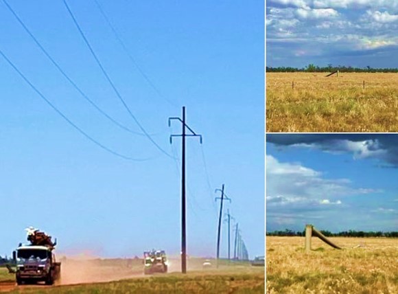 Trucks driving to a broken power pole